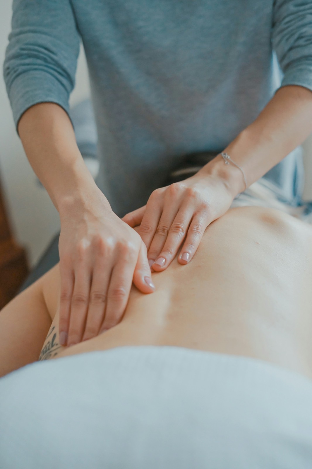 A member of our care team providing hands-on treatment during a session